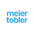 Meier Tobler Logo in leuchtendem Blau auf dunkelgrünem Hintergrund.