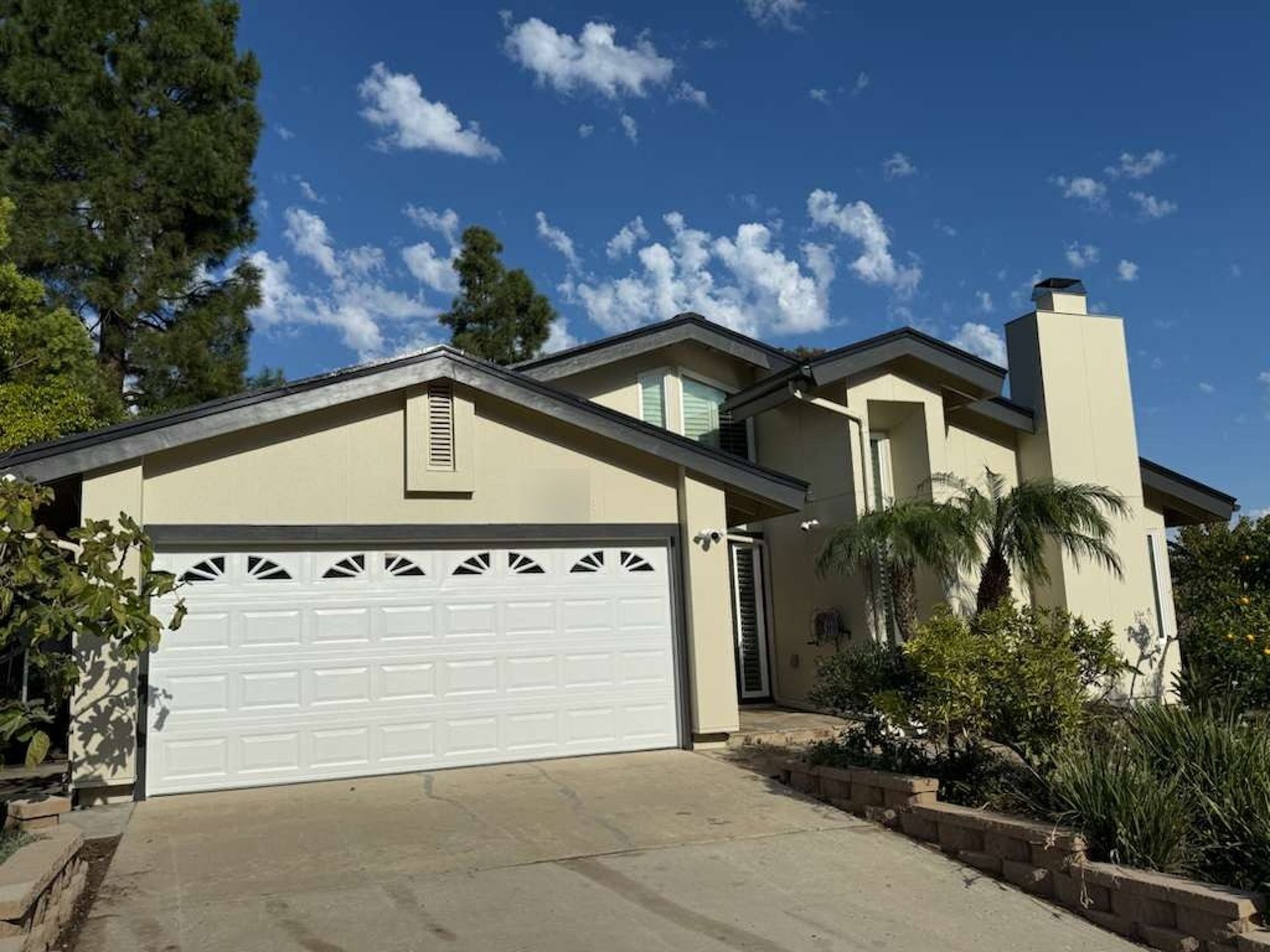Front of a San Diego home with James Hardie Architectural Panel siding in Sea Grass texture