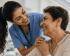 Compassionate nurse supporting an elderly woman during a healthcare consultation, representing preventive care, healthy aging, and patient-centered medicine.
