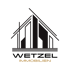Logo von Wetzel Immobilien: stilisierte schwarze Gebäude auf  weißen Hintergrund, darunter "WETZEL IMMOBILIEN".