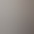 Ein Techniker in Schutzkleidung schlägt mit einem Hammer auf einen Bohrer, der in eine Wand eingeführt ist.