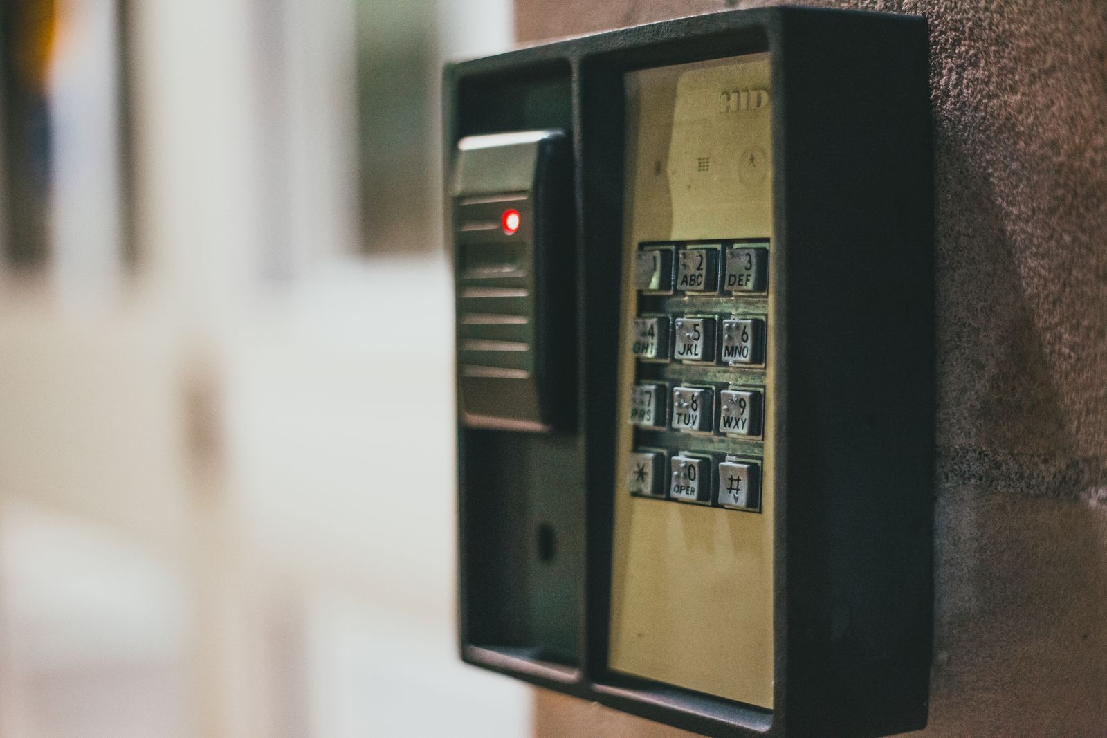 A home security control panel on an interior wall