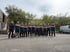Das Team von Räum und Abrissprojekt in Firmenshirts vor einem Container