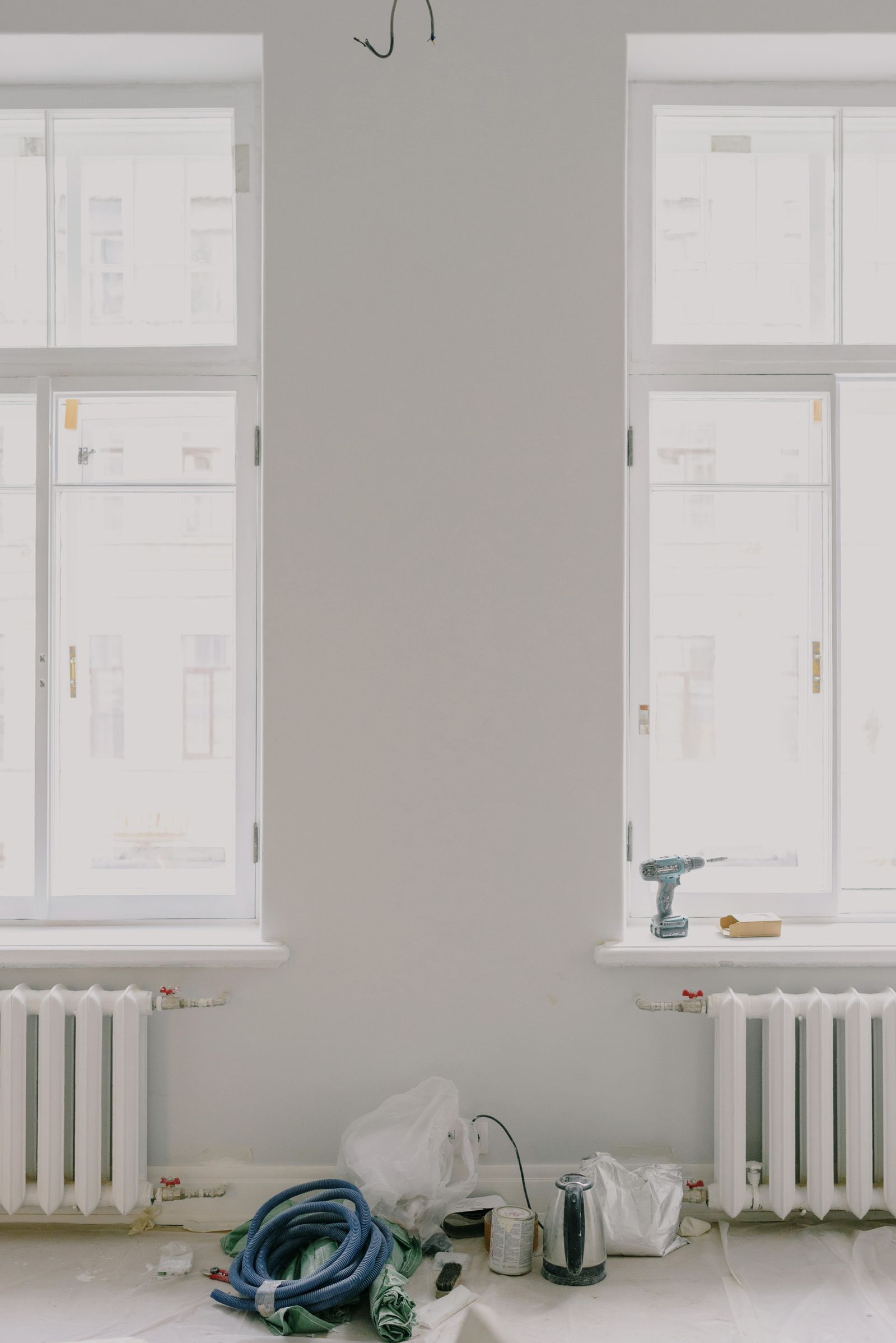 Newly installed replacement windows in a bright room at the end of an install day