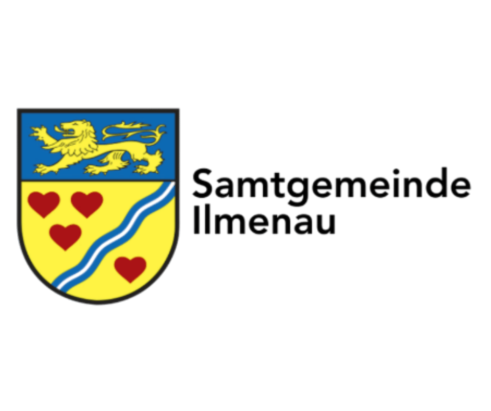 Logo von Lügde: Rote Skyline, blauer Hügel, Schriftzug "Lügde Staatlich anerkannter Erholungsort".