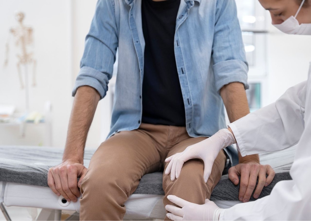 Provider examining a patient's knee