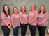 Five female employees in "The Farm Clinic" t-shirts.