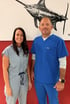 Chiropractic clinic staff smiling in wellness care setting