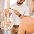 A doctor consulting a patient regarding spinal cord issues and sciatica treatment.