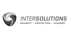 Logo von Intersolutions: schwarzer Schild mit silbernem Wirbel und grauem Text "INTERSOLUTIONS SECURITY / PROTECTION / ACADEMY".