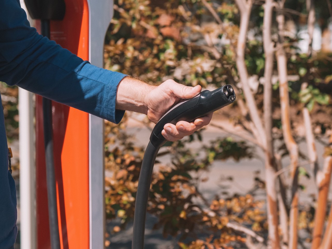 Level 2 EV charger charging a car overnight in a Laguna Niguel driveway