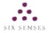 Six Senses Logo mit sechs dunkelroten Punkten, die ein Dreieck bilden, darüber der Text "SIX SENSES".
