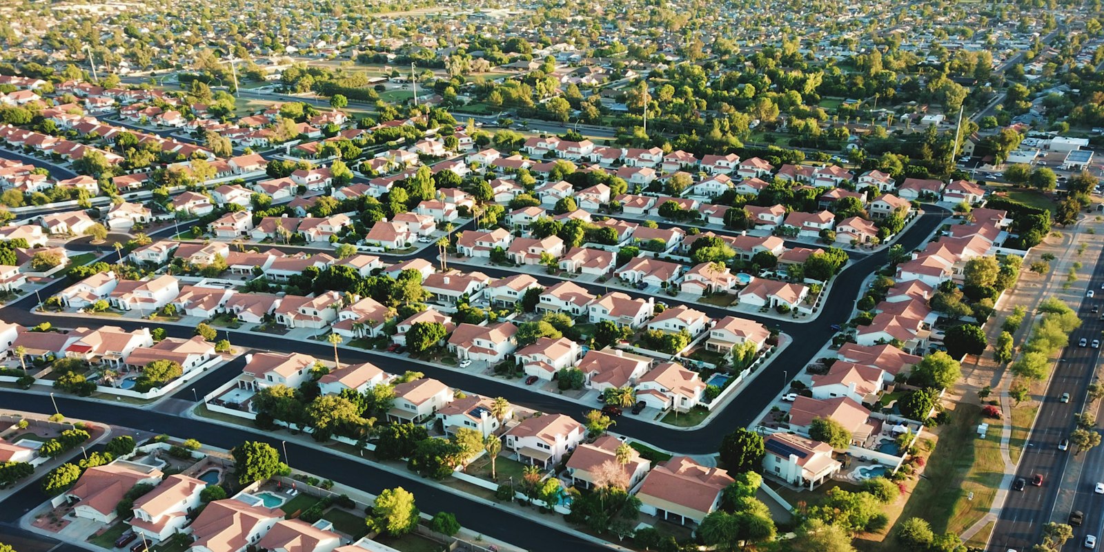 Aerial view of a residential neighbourhood of single-family roofs