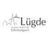 Graues Logo mit stilisierten Gebäuden, Schriftzug "Lügde" und "Staatlich anerkannter Erholungsort".