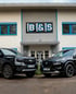 B&S Sicherheitszentrale mit schwarzen SUVs.png