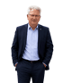 Mann mittleren Alters mit grauen Haaren, Brille und dunklem Anzug mit blauem Hemd und Abzeichen.