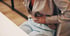 Woman clutching lower abdomen in pain