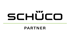 Schüco Partner-Logo auf grünem Hintergrund mit einer grünen Linie.