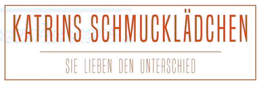 Roter Text auf weißem Hintergrund: "KATRINS SCHMUCKLÄDCHEN" über einer Linie, darunter "SIE LIEBEN DEN UNTERSCHIED".