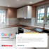 Moderne Küche mit weißen Schränken, Holztheke, Kochfeld, Spüle und einem Google-Review.