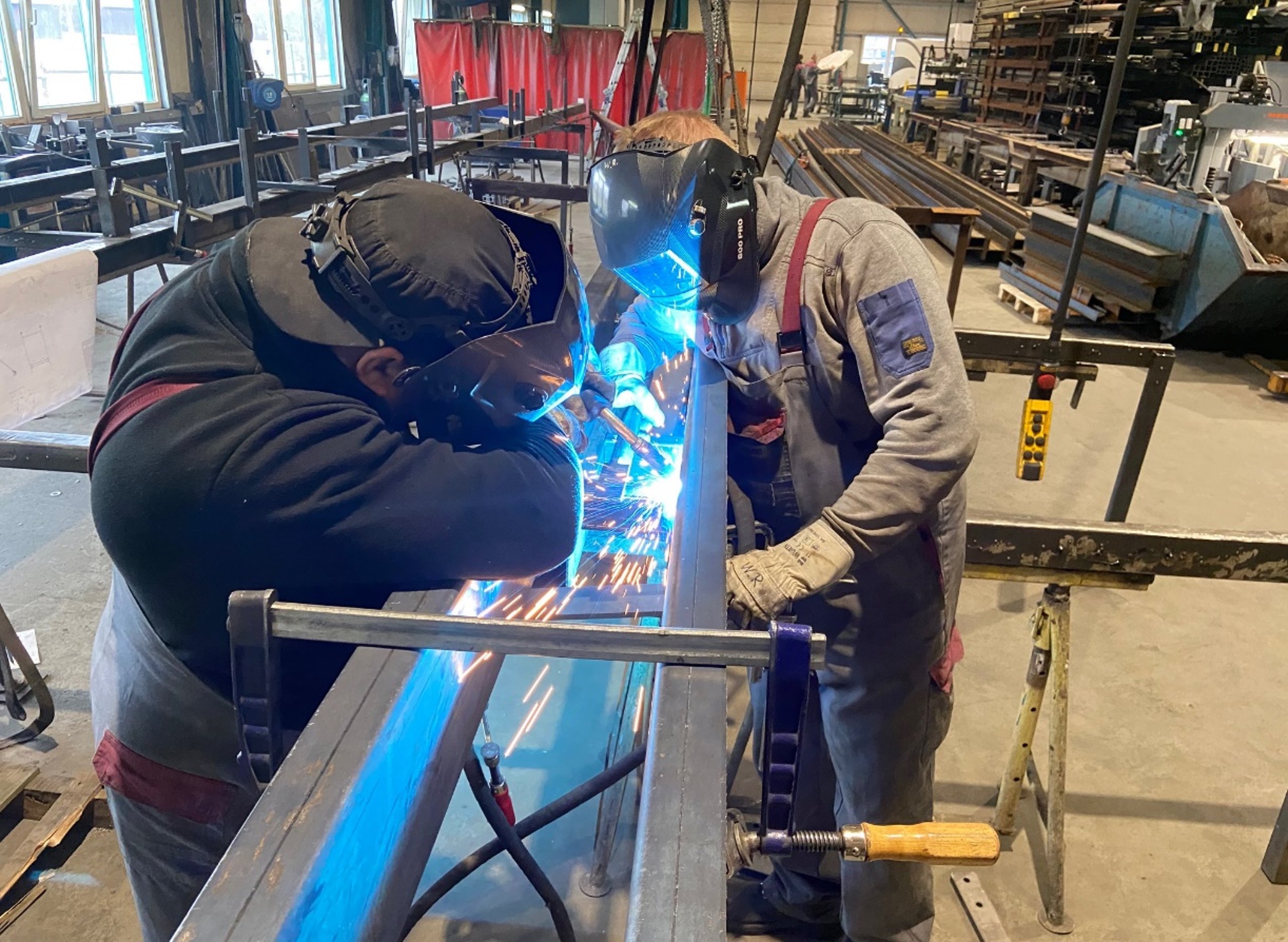 Welder working on a steel beam