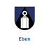 Wappen von Eben mit blauem Schild, schwarzem Dreieck und weißem Denkmal; Text: Eben.