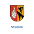 Wappen von Stumm mit Bischof und Ziegenbock, darunter der Ortsname Stumm in Blau.