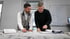 Christian und Fabian Roßmann arbeiten sich in Kundenakten ein, um deren Bauprojekte zu optimieren.