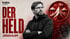 Jürgen Klopp mit verschränkten Armen neben dem Text „Der Held“ und einem Berg-Icon mit Flagge auf rotem Hintergrund.