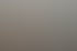 Modernes Badezimmer mit Doppelwaschbecken aus Holz, Badewanne, grauen Fliesen und weißer Tür.