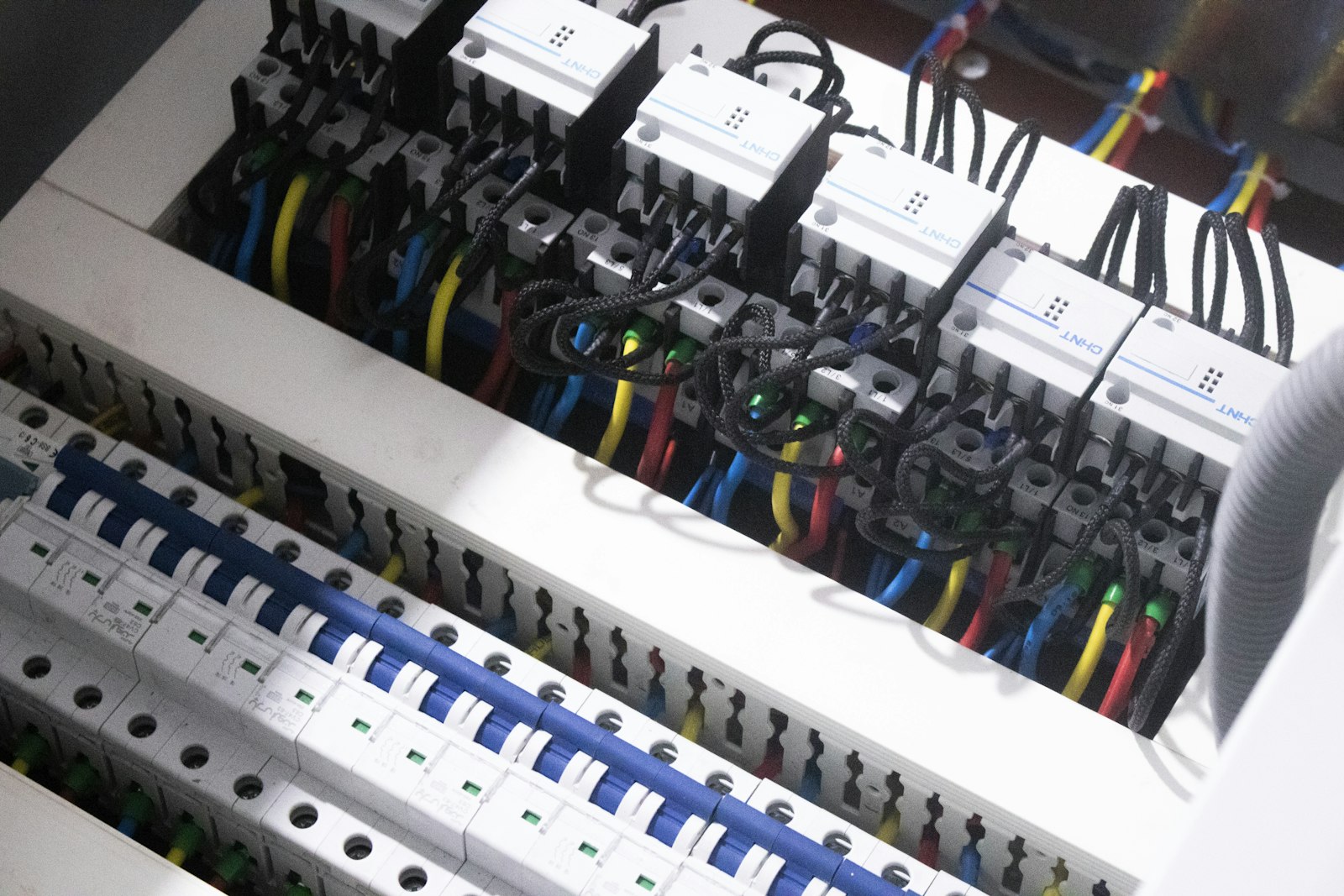 Electrical conductors landed and terminated on the terminals inside an open metal switch box