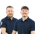 Fabian Berwert und Tobias Sidler lächeln in dunkelblauen Poloshirts.