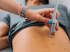 Advanced Laser & Light Therapy doctor treating lower back
