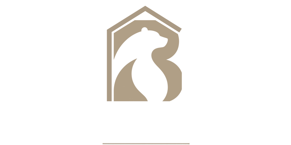 Logo von SBR Immobilien mit einem Bären-Symbol in Hausform auf schwarzem Hintergrund.