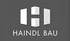 Logo von Haindl Bau mit einem stilisierten weißen Buchstaben H in Gebäudeform auf grauem Hintergrund.
