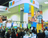 20x20x16 Coupons.com trade show booth with large hanging signage, demo stations, and attendee engagement areas. Great exposure for the brand.