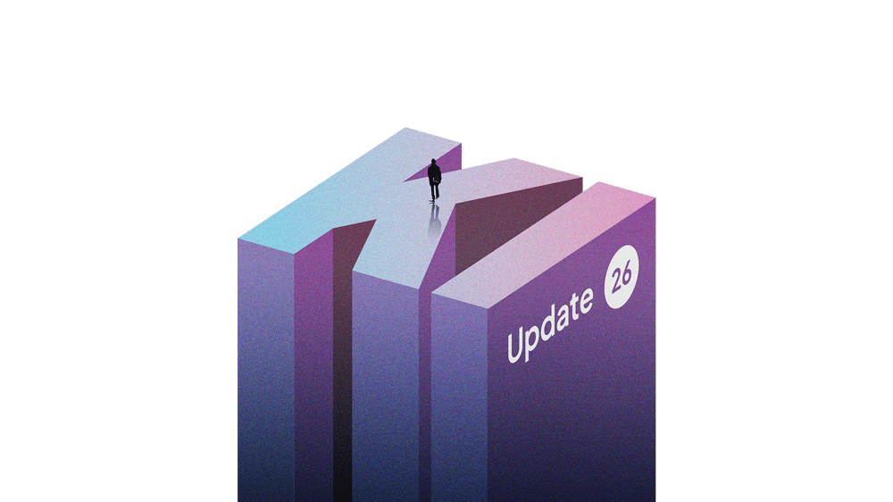 Eine Person steht auf einem großen 3D-Buchstaben „KI“ mit dem Text „Update 26“.