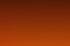 Verlaufende Farben in Rot-, Orange- und Gelbtönen auf schwarzem Hintergrund, unscharf.