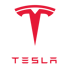 Rotes Tesla-Logo mit stilisiertem "T" und dem Schriftzug "TESLA" darunter auf grünem Hintergrund.