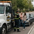 Eastvale Towing Services roadside assistance technician helping stranded motorists beside a disabled vehicle