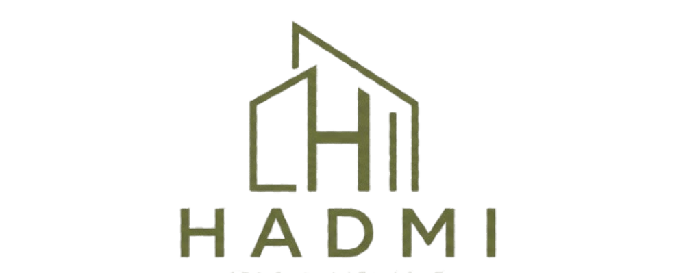 Goldenes HADMI Logo mit einem stilisierten Gebäude-Symbol in Form des Buchstabens H auf schwarzem Hintergrund.