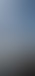Gondel der Nebelhornbahn fährt aus dem Nebel in den Sonnenschein