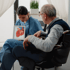 Healthcare provider explaining heart disease symptoms to patient
