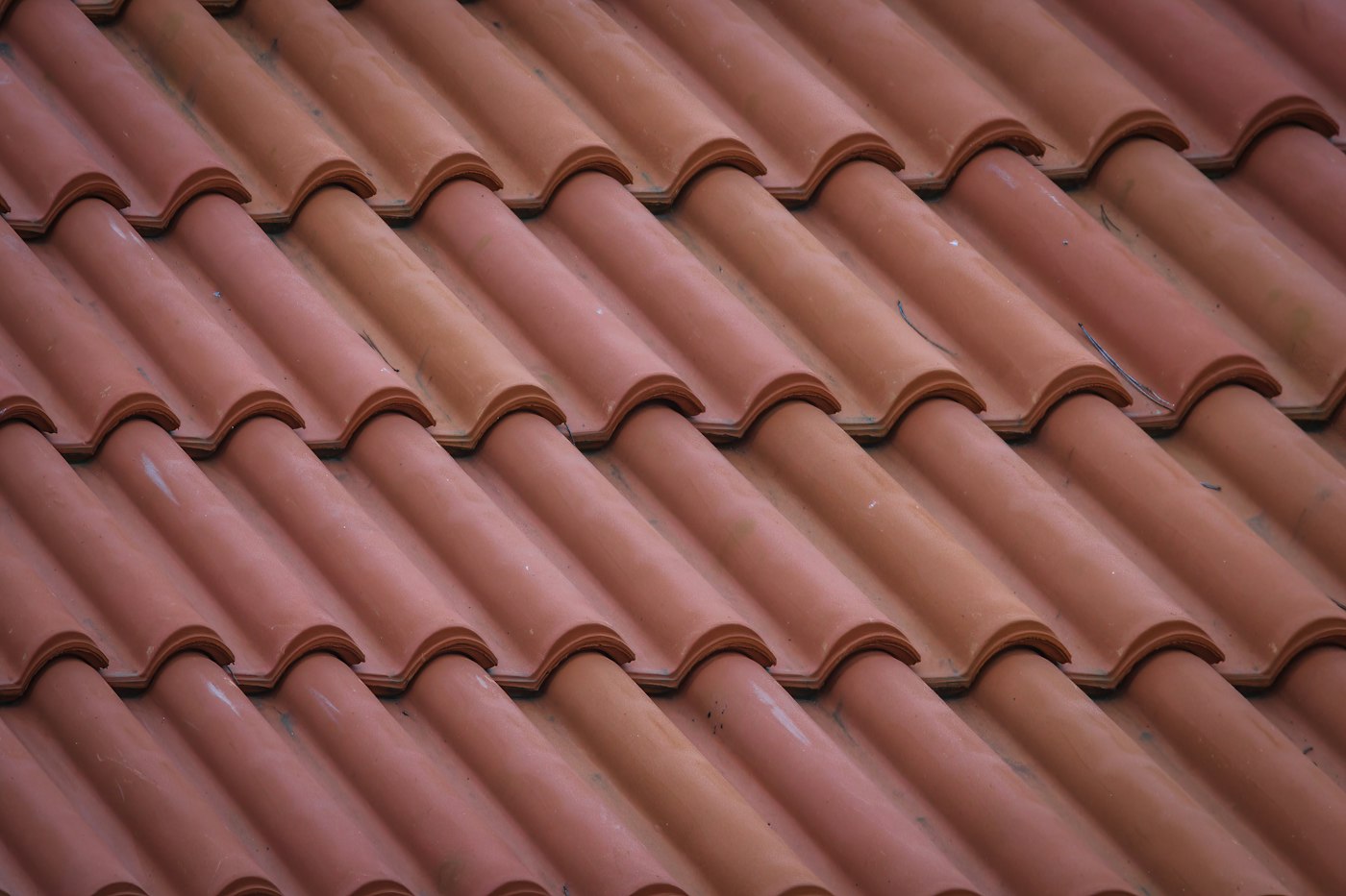 Close view of layered architectural shingles on a roof slope