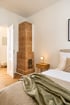 Bedroom with tiled stove