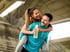 Active couple supporting each other in outdoor fitness and hydration