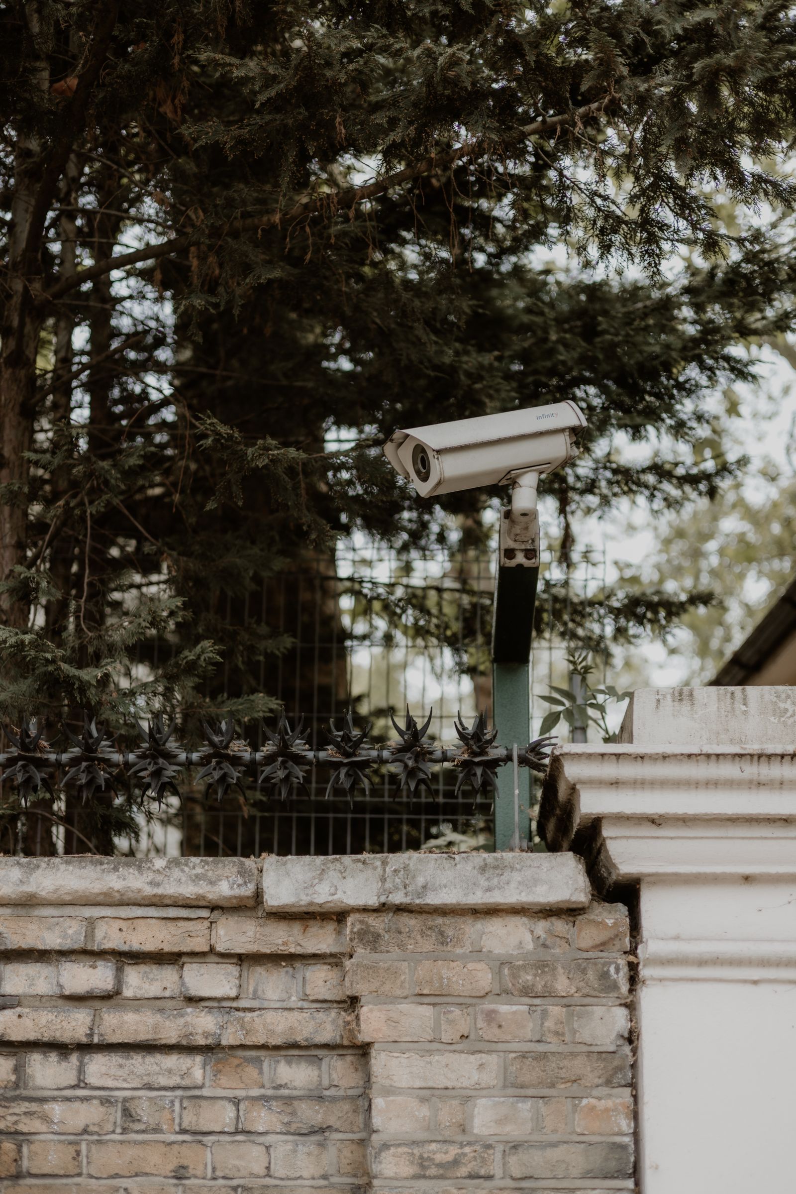 Outdoor security camera on a brick house wall