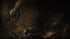 Abstract dark brown and gold textured background with illuminated specks and swirling patterns.