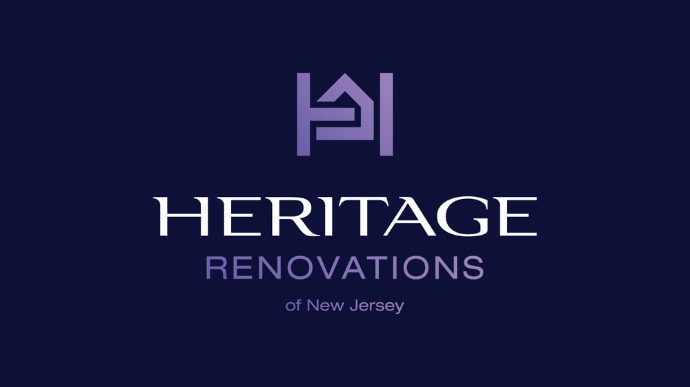 Heritage Renovations of New Jersey logo with a purple house icon above the white text "HERITAGE" and purple "RENOVATIONS".