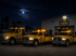 Towing Eastvale fleet of tow trucks staged outside headquarters at night, ready for 24/7 emergency towing and roadside assistance